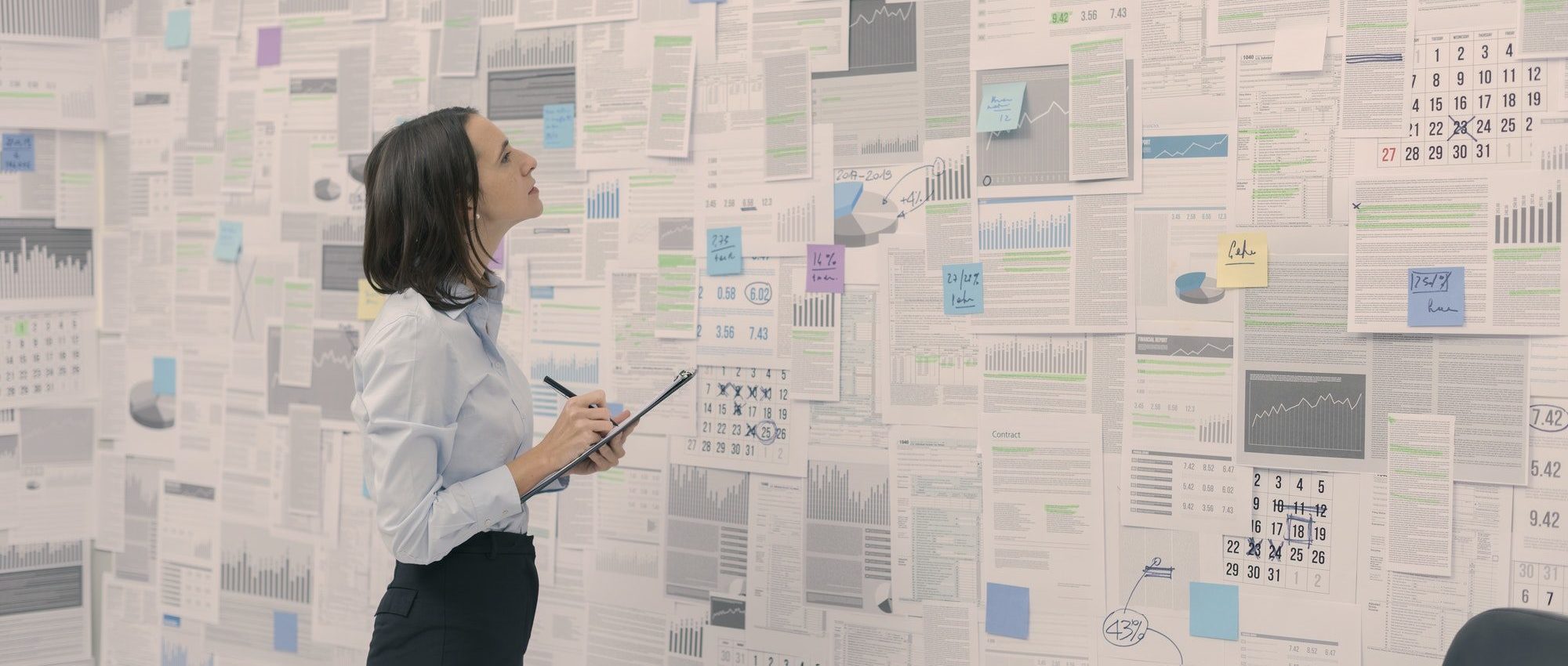 Corporate manager checking financial data and reports